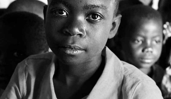 Image of an african boy with a sad look on his face
